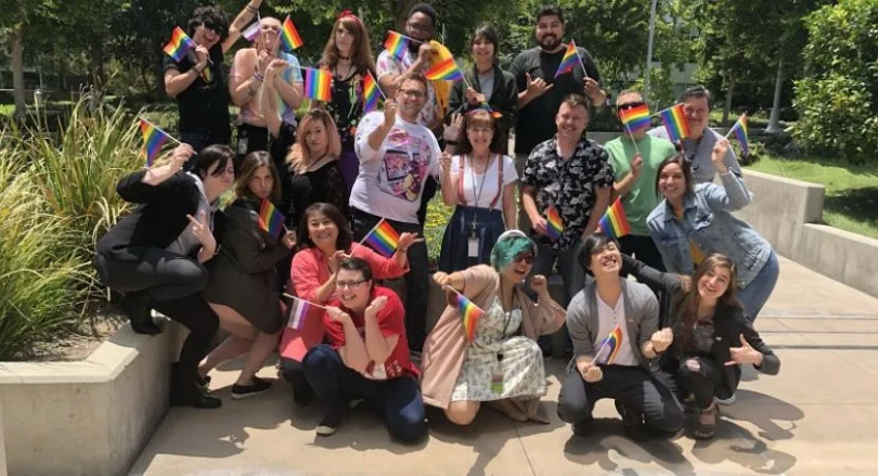 Crunchyroll staff members holding pride flags