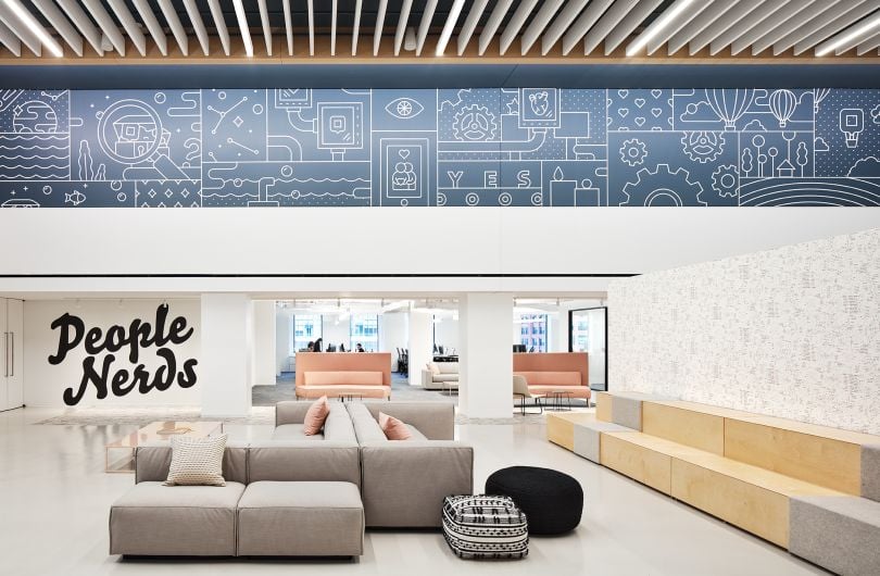 dscout’s office space lounge area, with wall art including the words “People Nerds.”