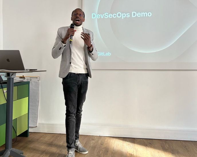 Madou Coulibaly speaking at a GitLab DevSecOps Demo meetup.