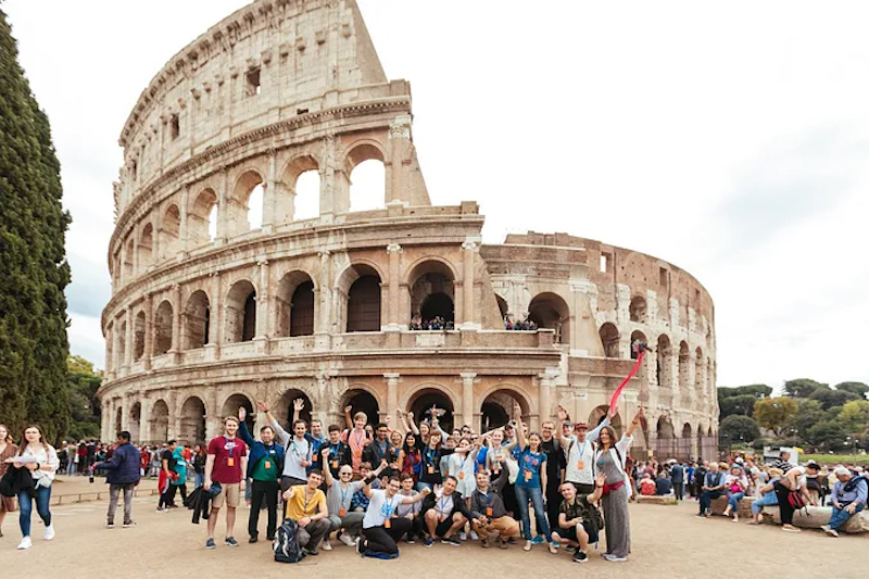 Grammarly staff in front of the Colosseum in Rome