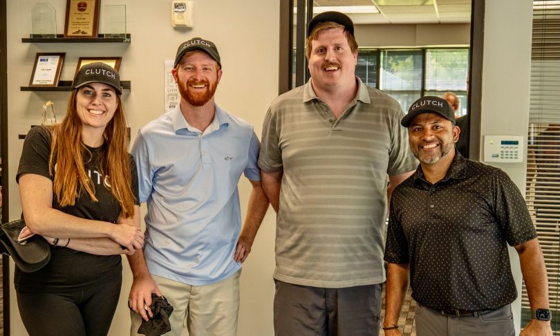 Members of the OTR Solutions team posing for a photo in the office