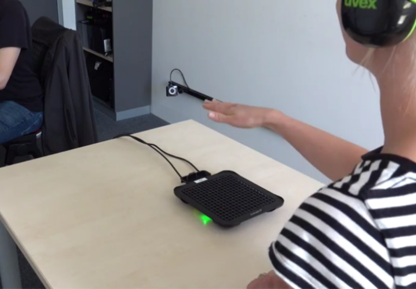 photo of someone using a haptic braille reader