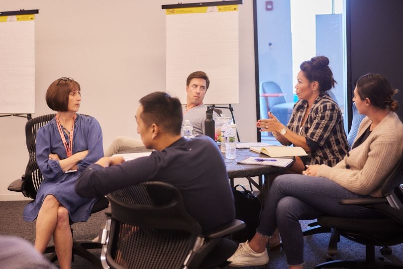 hologram team members in an office