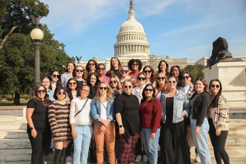 A group of Osano employees stand in front of the U.S. Capitol building.