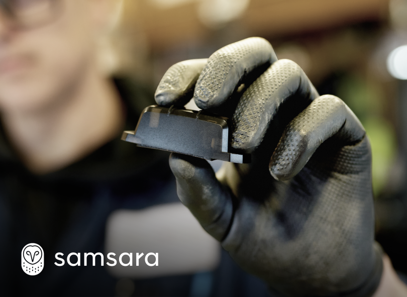 A close-up image of a technician holding the Samsara AT11.