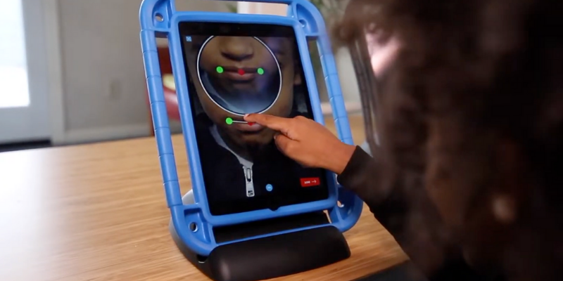 A child interacting with the Innervoice software on a tablet device.