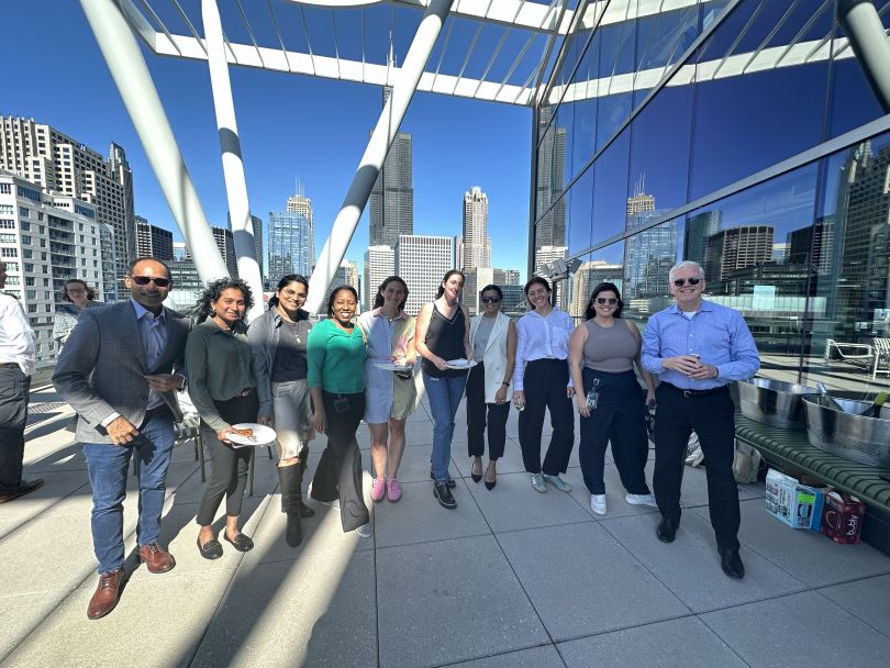 Kalderos team members enjoy a rooftop event. 