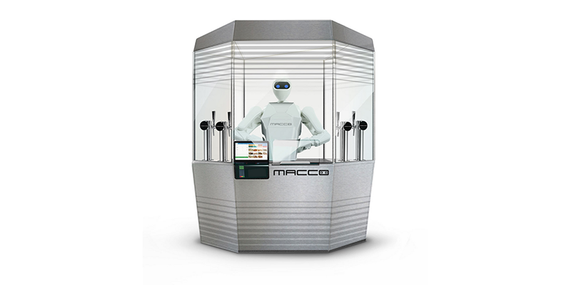 The humanoid robot, Kime, standing behind a beverage bar.