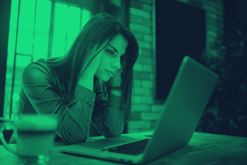 Woman looking at computer frustrated Stock