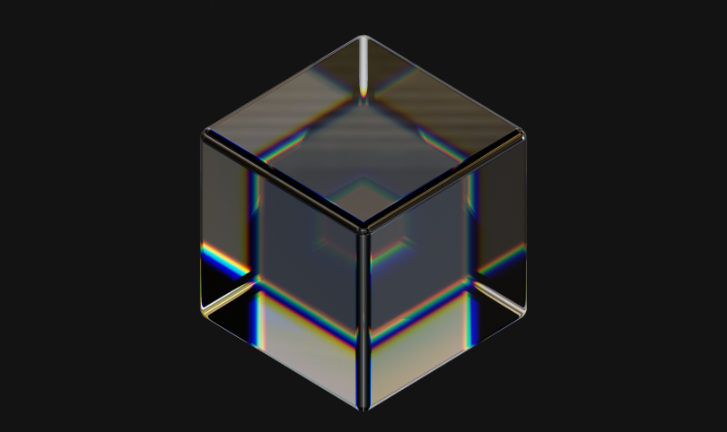 An image of movement's logo: a reflective glass cube. 