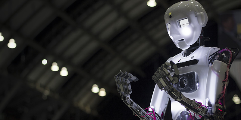 The humanoid robot, robothespian, expressing emotion with its fists balled in anguish.
