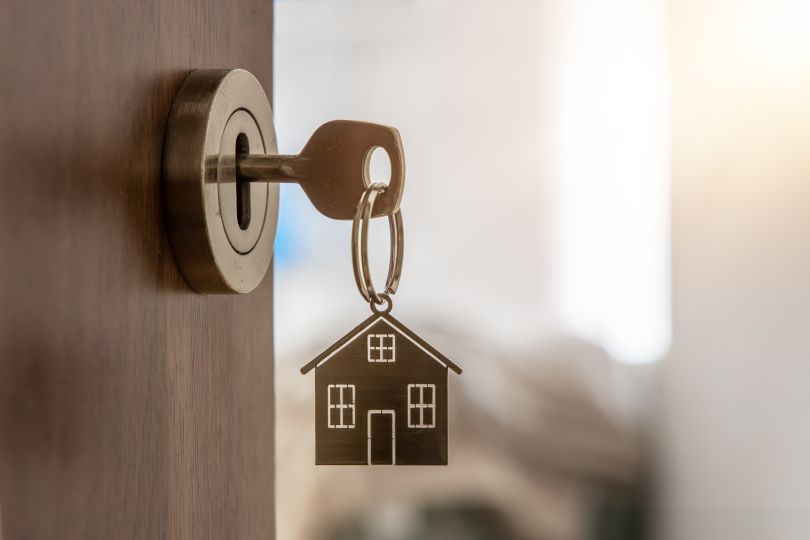 A key opens the door to a home. 