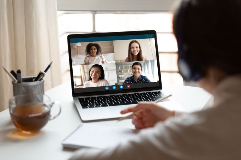 A meeting taking place virtually on a laptop