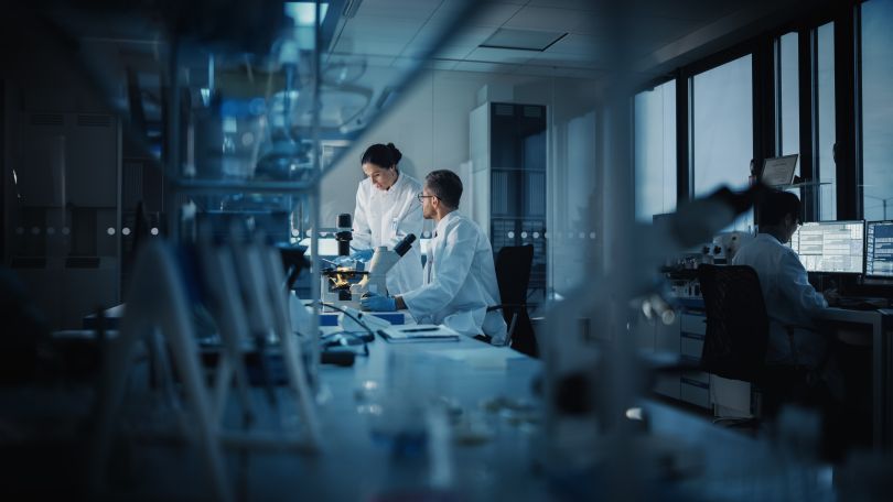 Two technicians work in a medical lab