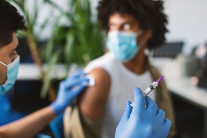 A patient in a clinical trial receives an injection