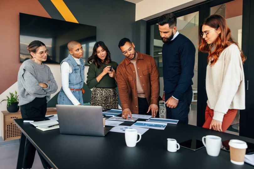 Team members collaborate in a common space.