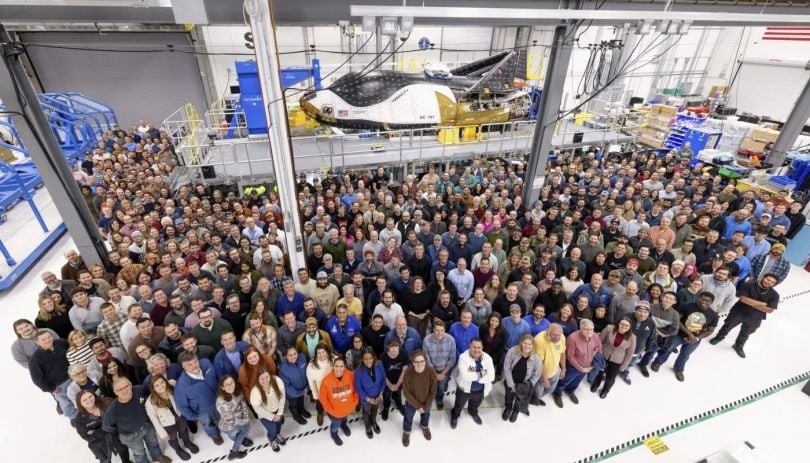 The Sierra Space team poses with the company’s “Dream Chaser” spaceplane.