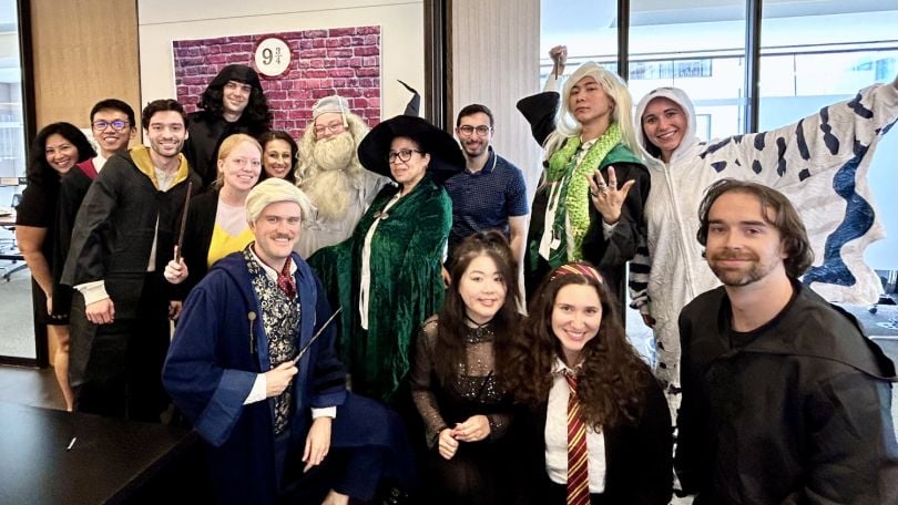 Tapestry employees pose for a group photo while wearing Harry Potter-themed costumes.