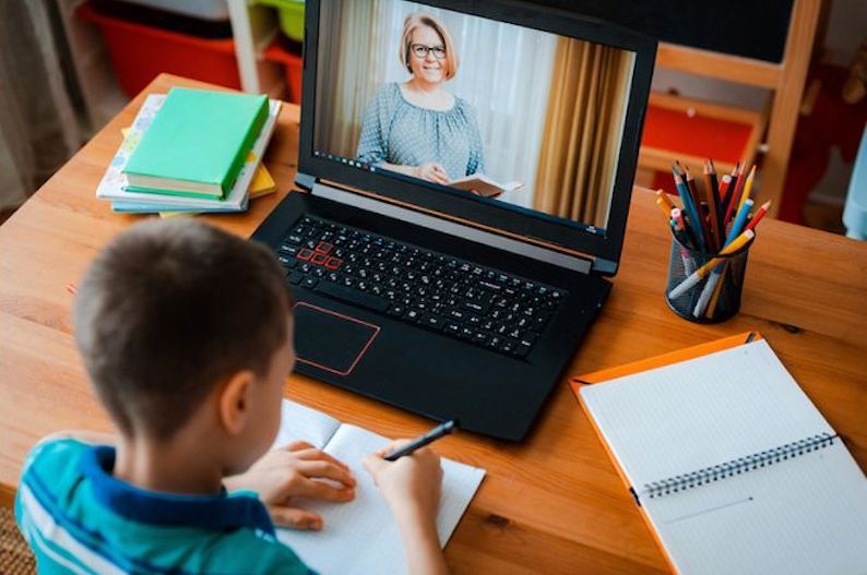 A little boy studying