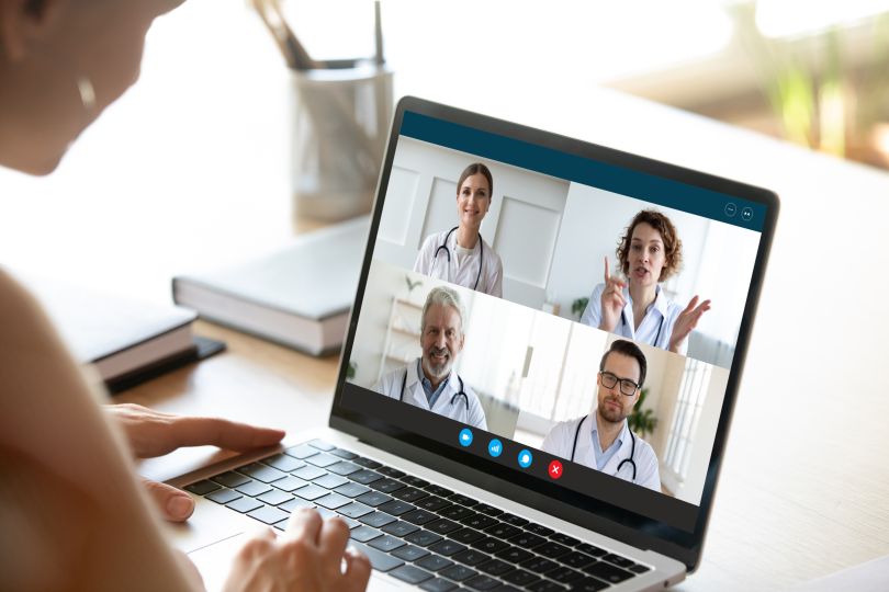 A conference call on a laptop between medical professionals