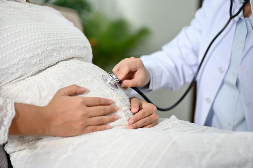 A pregnant patient receives a checkup.