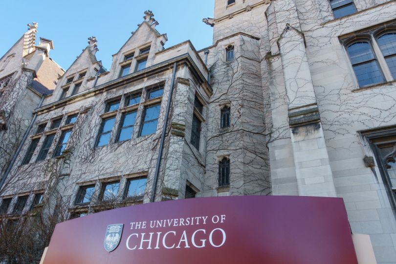 An exterior photo of the University of Chicago is shown.