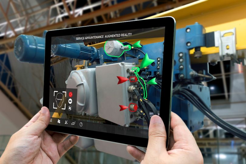 Man on iPad uses augmented reality