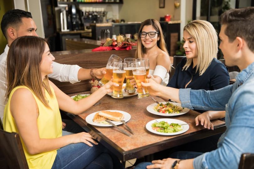 Friends toasting at dinner