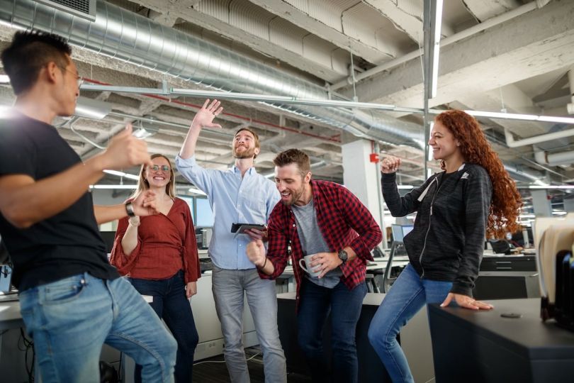 VelocityEHS team members enthusiastically celebrate a shared achievement. 