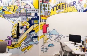 Office wall with illustrations, company values language