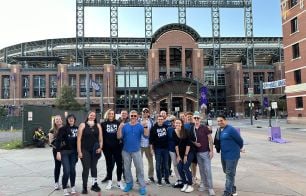Aquia team outside of Coors field in Denver on a teambuilding activity