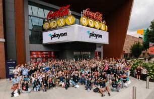 Group photo of PlayOn team in front of the Coca-Cola Roxy concert venue.