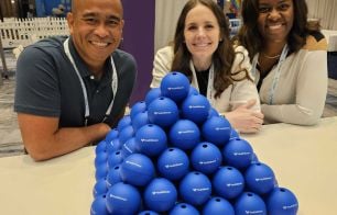 Three HealthSherpa employees at a conference
