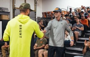 Employee receives award from a leader