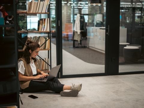 A Celonis Employee hard at work on their laptop in Madrid.